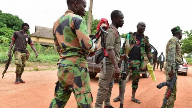 Mutinous soldiers stand inside a military camp in the Ivory Coast