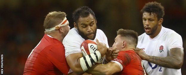 England's Billy Vunipola is stopped by the Wales defence
