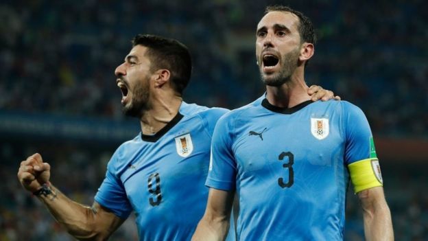 Luis Suárez y Diego Godín
