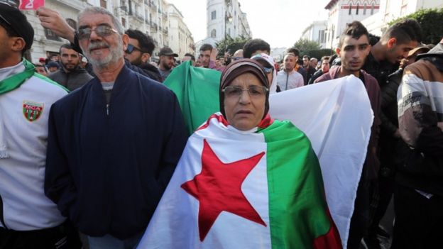 Algerians chant slogans during a protest rally in Algiers, Algeria, 12 December 2019.