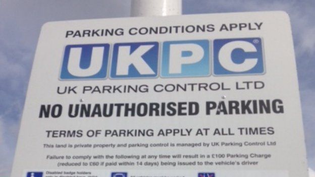 Parking: Cardiff driver's £100 fine after tyres touch yellow box - BBC News