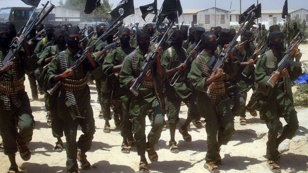 Al-Shabab fighters perform military drills at a village about 25km outside Mogadishu
