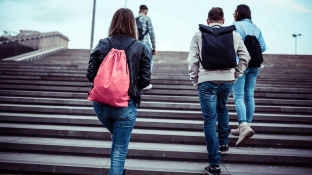 Students walking up a staircase