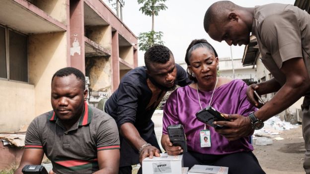 Inec staff begin reconfiguring Smart Card Readers, that were set to work on the previous election day
