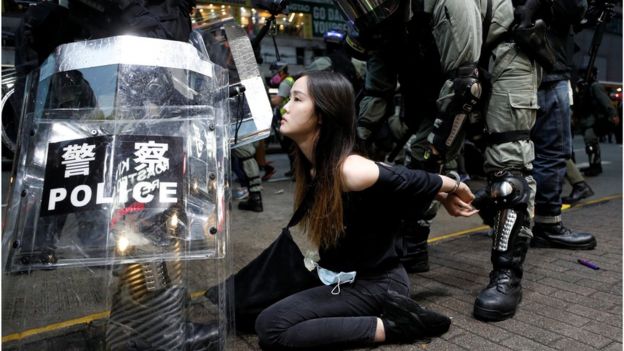 Riot police detain a protester during an anti-government rally in central Hong Kong, China October 6, 2019