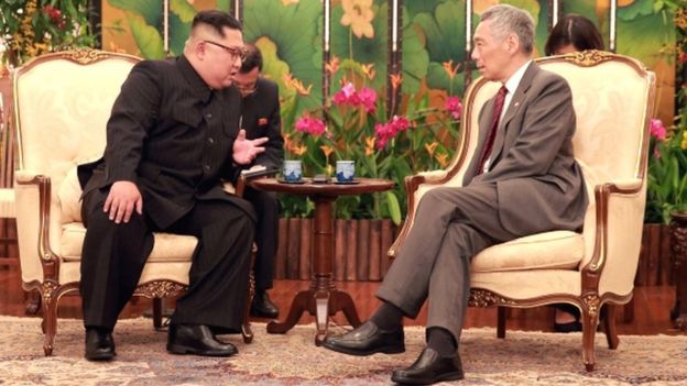 North Korean leader Kim Jong-un speaks with Singapore Prime Minister Lee Hsien Loong at the Istana in Singapore, 10 June 2018