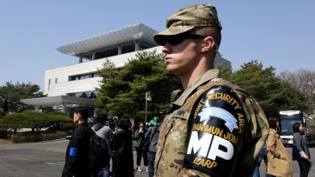 A US soldier stands guard in front of the Peace House in the demilitarized Zone between South and North Korea