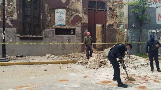 Authorities clear debris after an earthquake in Oaxaca, Mexico, 23 June 2020.