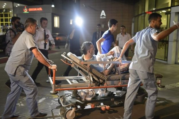 Medics take an injured man to hospital in Istanbul