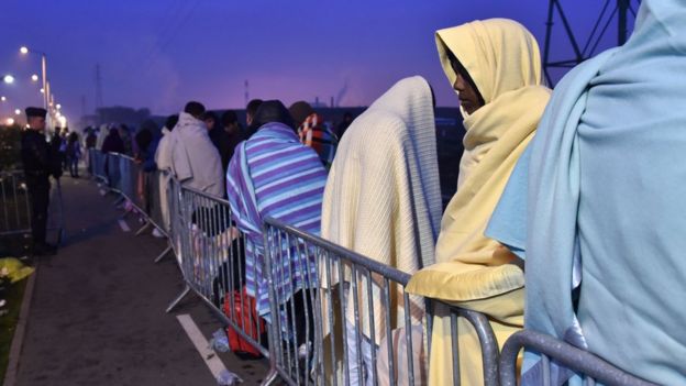 Migrants awaiting evacuation from the Calais camp in France
