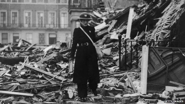 Air raid warden in damaged area