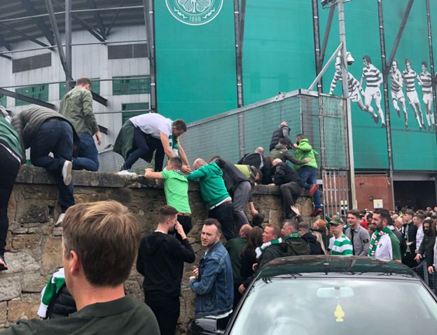 Fans climbing out of the ground