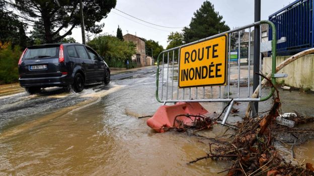 Sign reading 'flooded street'