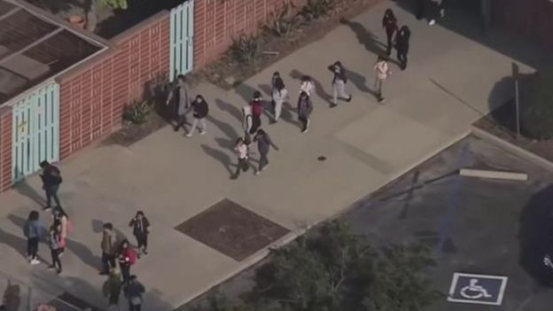 বিমান থেকে ফেলে দেওয়া তেল পড়েছে স্কুলের শিক্ষার্থীদের ওপর।