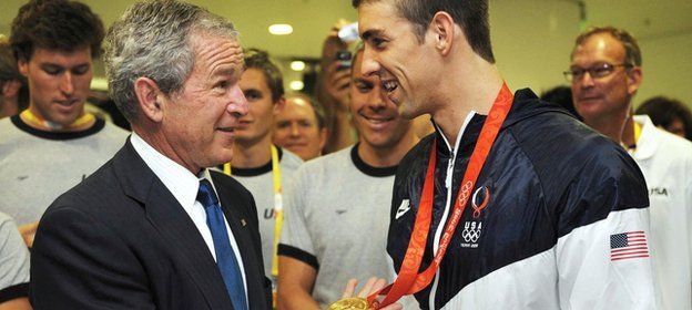 Former US President George W. Bush and US swimmer Michael Phelps