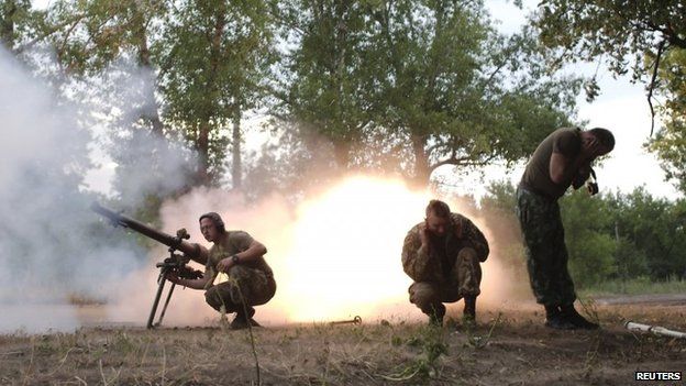 Ukrainian forces firing grenade