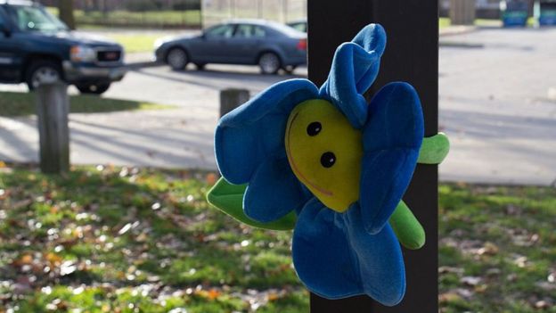 A solitary toy is left in a park as a memorial for Tamir Rice