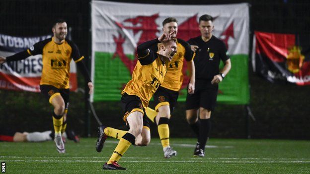 Annan's Iain Anderson celebrates making it 4-3 during against Clydebank in the 123rd minute at Holm Park