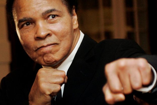 U.S. boxing great Muhammad Ali poses during the Crystal Award ceremony at the World Economic Forum (WEF) in Davos, Switzerland, in this January 28, 2006 file photo.