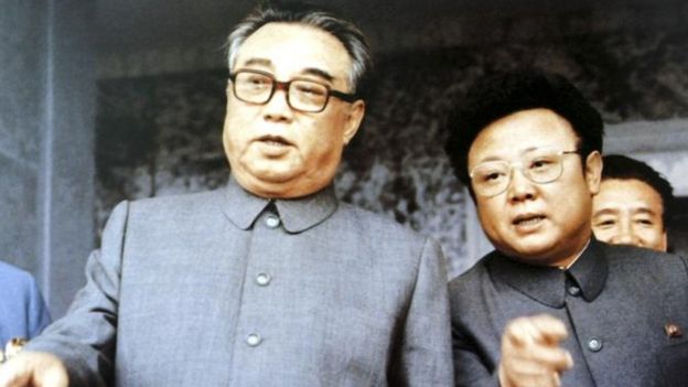 Kim Il-sung, left, founder of North Korea, chats with his son Kim Jong-il at a mass rally to celebrate the foundation of the communist country in Pyongyang in this September 1983