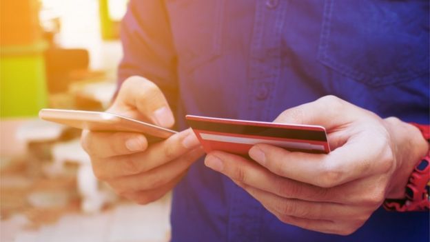 Man adds debt card details to phone app