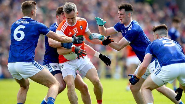 Surrounded - Armagh's Mark Shields faces a Cavan quartet in the Clones encounter