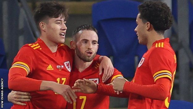 Wales celebrate Rubin Colwill's goal