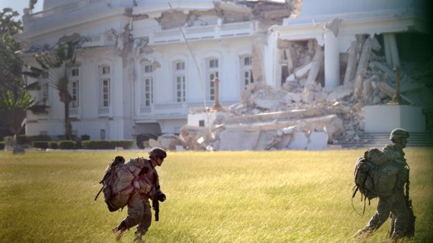 A platoon of US paratroopers inserted by helicopters secures the heavily damaged presidential palace in Port-au-Prince January 19, 2010.