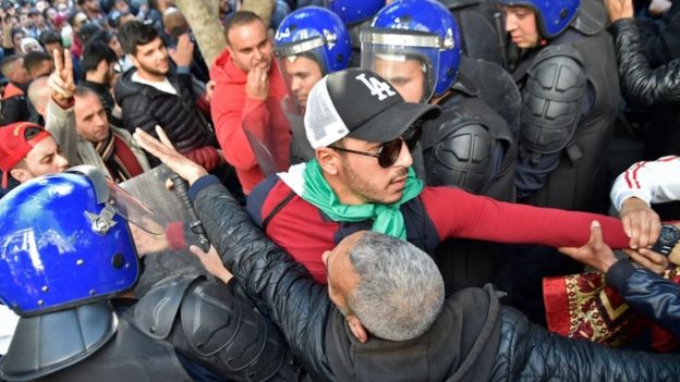 Algerian protesters scuffle with police