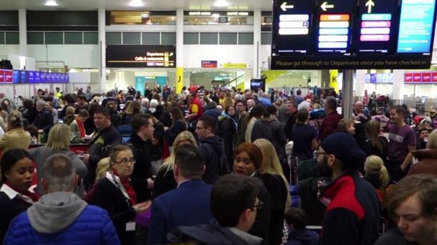 Gatwick Airport passengers queuing at check in