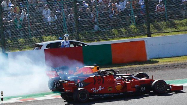 The cars of Max Verstappen and Charles Leclerc collide