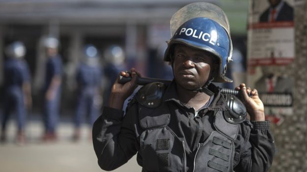 An anti-riot policeman in Harare, Zimbabwe - 2 August 2018