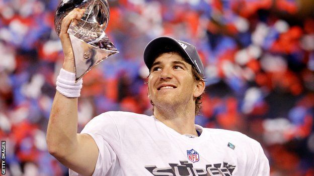 New York Giants quarterback Eli Manning lifts up the Vince Lombardi trophy after beating the New England Patriots in the 2012 Super Bowl