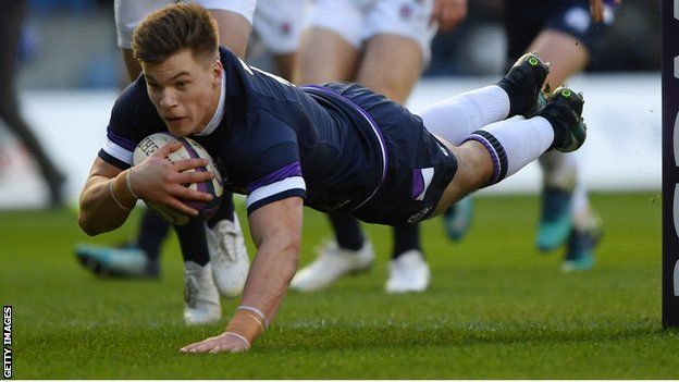 Huw Jones dives over to score the first of his two tries