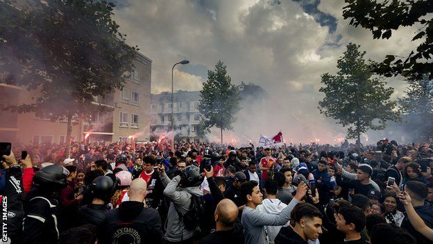 Fans gather outside of the home of Dutch midfielder Abdelhak Nouri on July 14, 2017 in Amsterdam. Ajax Amsterdam's football player Abdelhak Nouri was diagnosed with 'serious and permanent brain damage' after collapsing on July 8 during a practice match against Werder Bremen