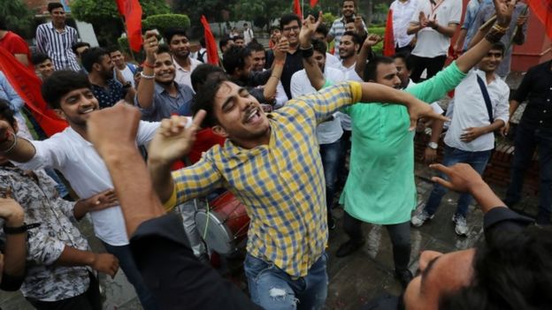 Supporters of the ruling BJP's student wing celebrate in Delhi