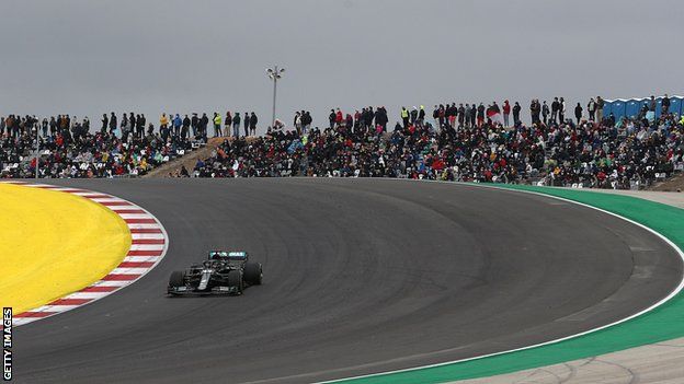 Lewis Hamilton during the Portuguese Grand Prix with large crowds watching in the stands