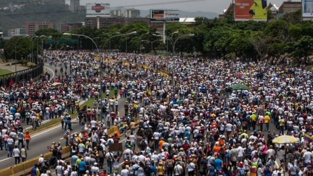 Demonstrators during an opposition protest in Caracas, Venezuela, on 19 April 201
