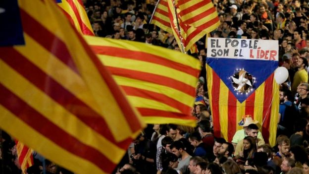 Catalans wave flags as they celebrate parliament declaring independence
