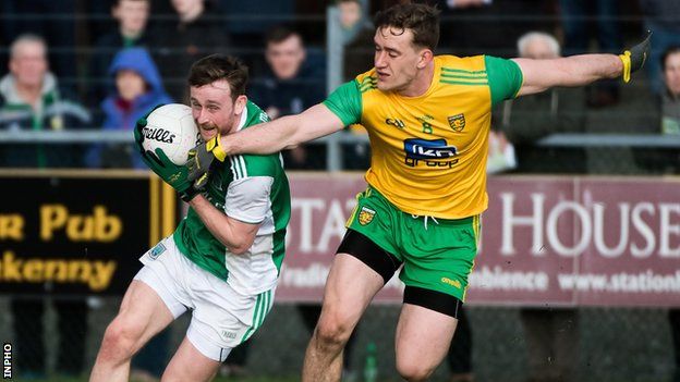 Ciaran Corrigan attempts to get past Donegal's Hugh McFadden in Letterkenny