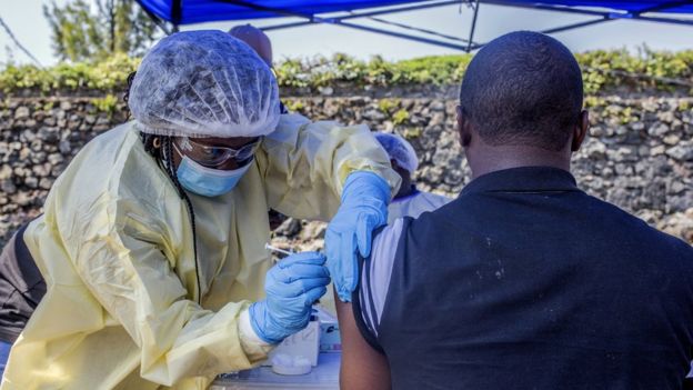 A man receives a vaccine in DR Congo