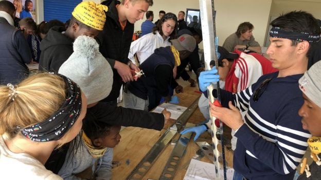 Teenagers assembling the Sling 4 plane in South Africa