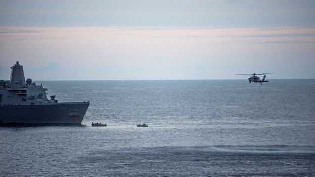 A supplied image obtained from the US Defence Force on 6 August 2017 shows search efforts for three US Marines missing after their MV-22 Osprey tilt-rotor aircraft crashed into the sea off Australia's northeast coast