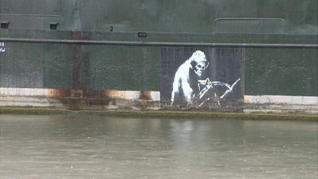 Banksy's Grim Reaper image seen on the side of the ship
