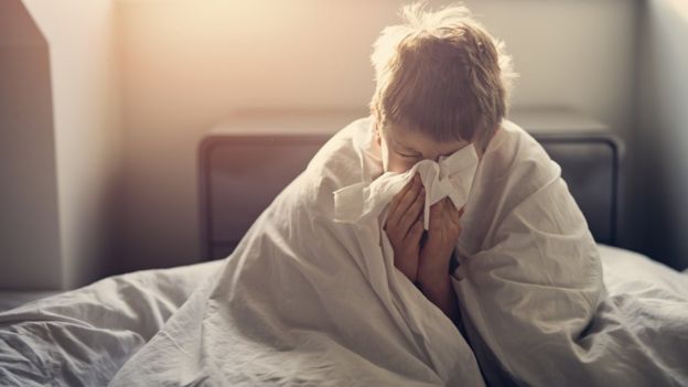 Niño con gripe