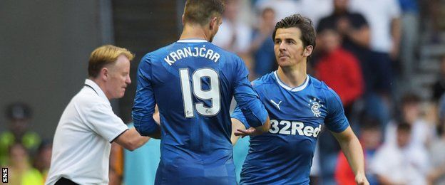 Joey Barton shakes hands with Niko Kranjcar as he comes on for his debut