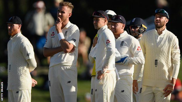 Stuart Broad (second left) and England watch a review on the big screen