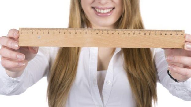 Woman with ruler