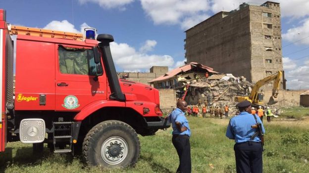 Rescue teams at the scene of a building collapse in Nairobi, 13 June 2017