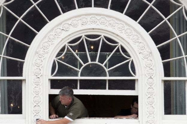 a worker fixes windows